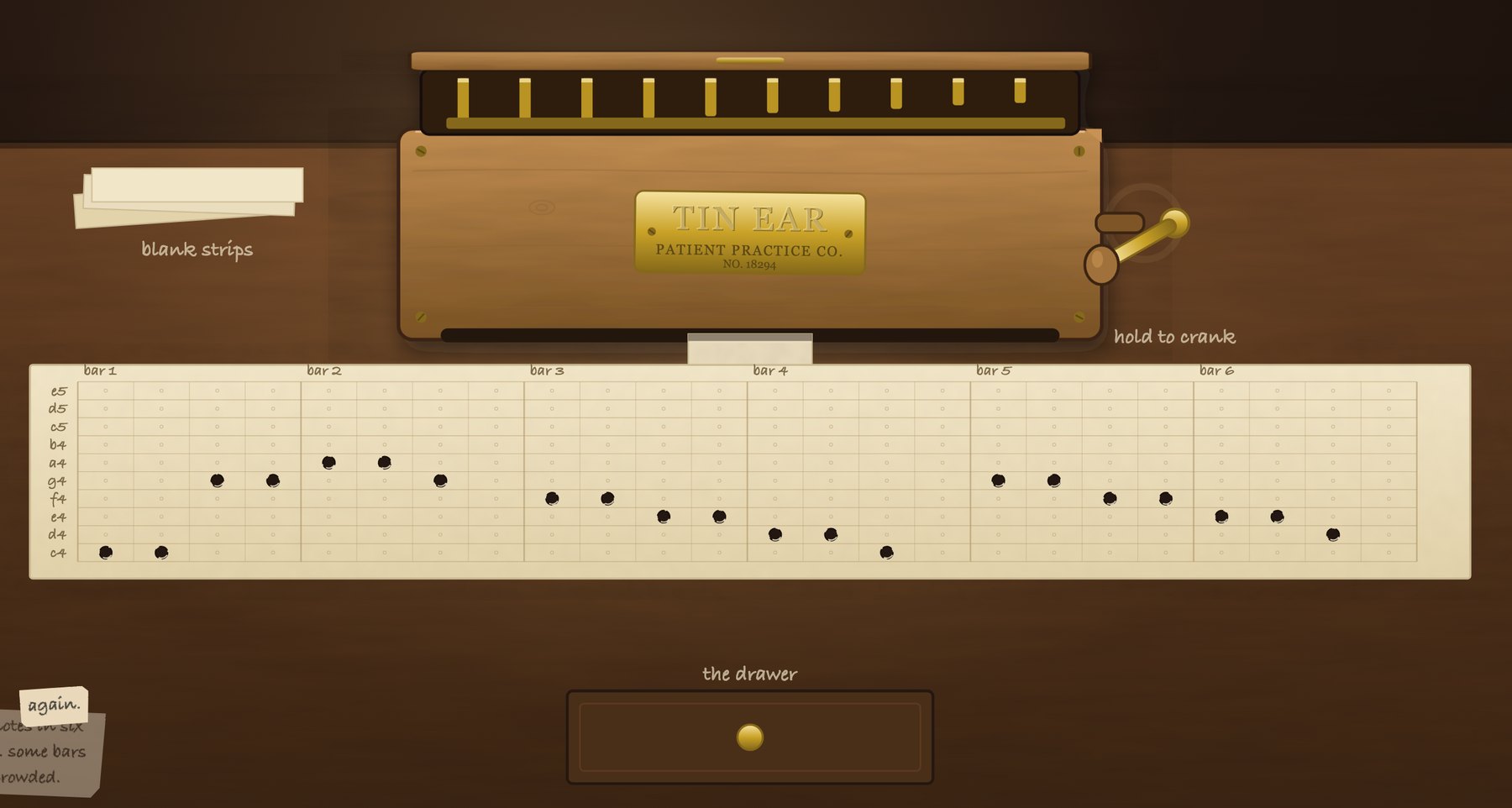 The Tin Ear music box with its lid open, ten brass tines above a punched paper strip, and a pencil note reading &lsquo;again.&rsquo;